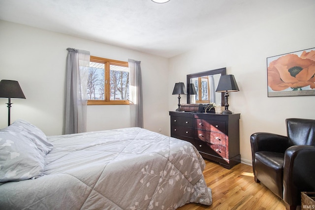 bedroom with light hardwood / wood-style floors