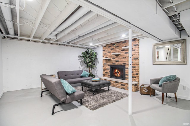 living room featuring a fireplace and concrete floors