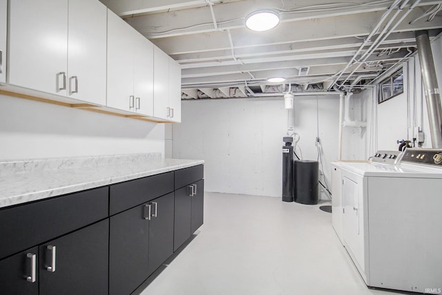 laundry area featuring cabinets and separate washer and dryer