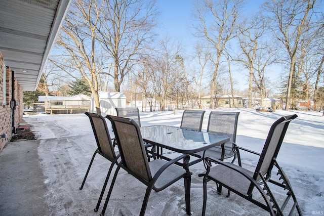 view of snow covered patio