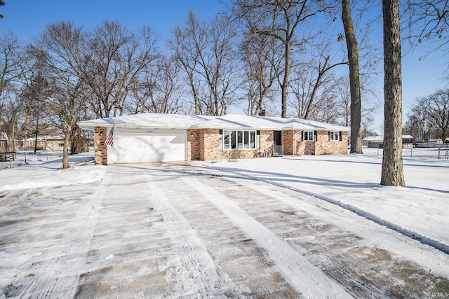 single story home with a garage