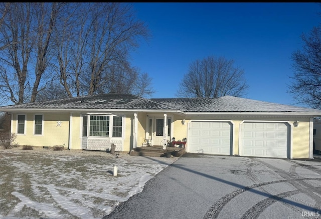 ranch-style house featuring a garage