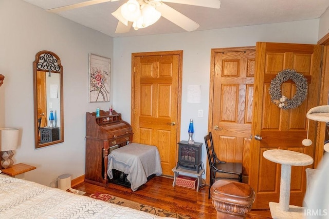 bedroom with hardwood / wood-style flooring and ceiling fan