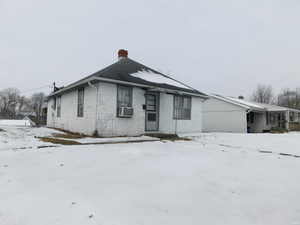 view of front of home featuring cooling unit