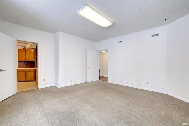 empty room featuring carpet flooring