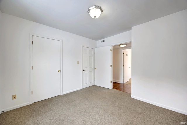 unfurnished bedroom with carpet