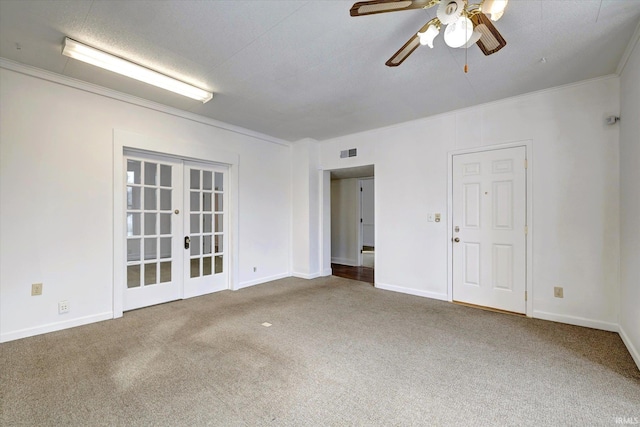 unfurnished room featuring crown molding, carpet, ceiling fan, and french doors