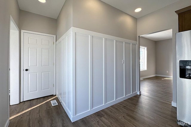 hallway with dark hardwood / wood-style floors