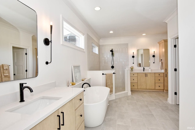 bathroom with vanity, tile patterned flooring, crown molding, and plus walk in shower