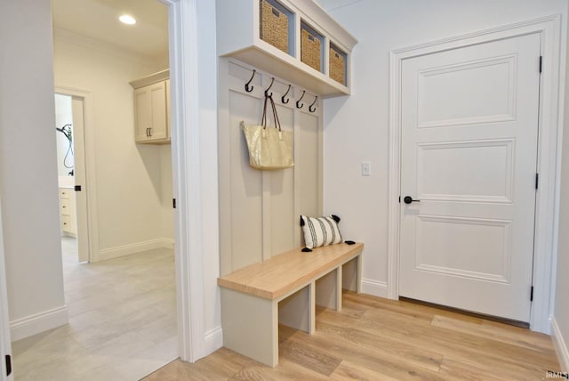 mudroom with light hardwood / wood-style flooring