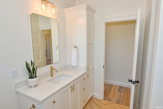 bathroom with wood-type flooring and vanity