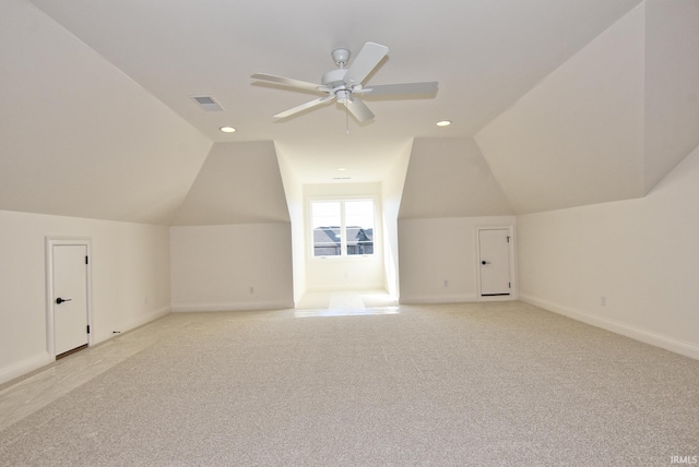 bonus room featuring vaulted ceiling, light colored carpet, and ceiling fan