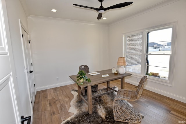 office area with wood-type flooring, ceiling fan, and crown molding