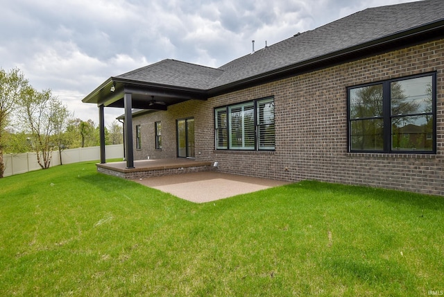 2102 Chadwick Dr, Newburgh, IN 47630 - rear view of house featuring fence, ceiling fan, a patio, a lawn, and brick siding