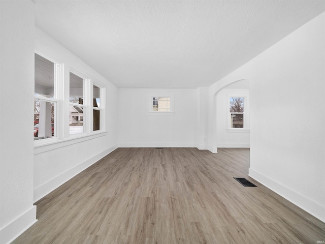 spare room with light hardwood / wood-style flooring