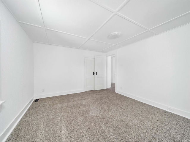 unfurnished room with carpet floors