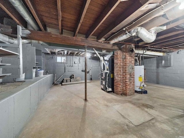 basement featuring heating unit, electric panel, and water heater