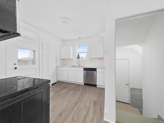 kitchen with electric range, light hardwood / wood-style floors, white cabinets, decorative backsplash, and stainless steel dishwasher