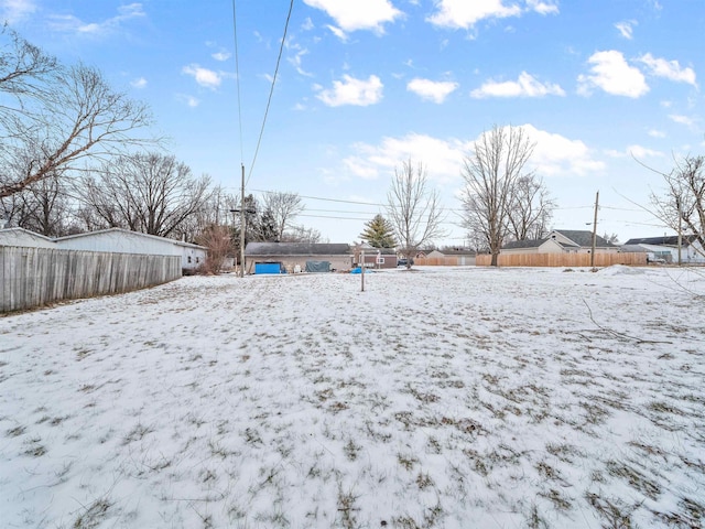 view of yard covered in snow