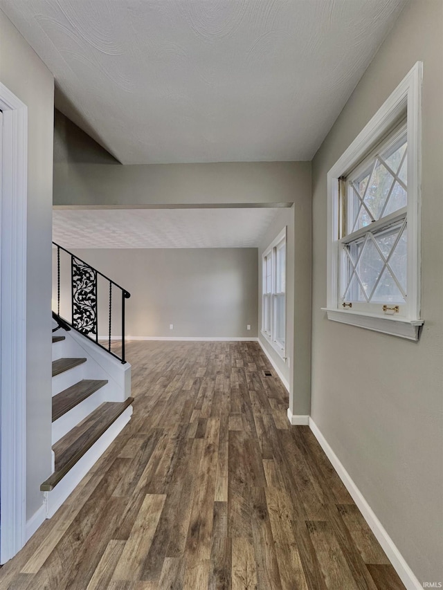 interior space with dark wood-type flooring