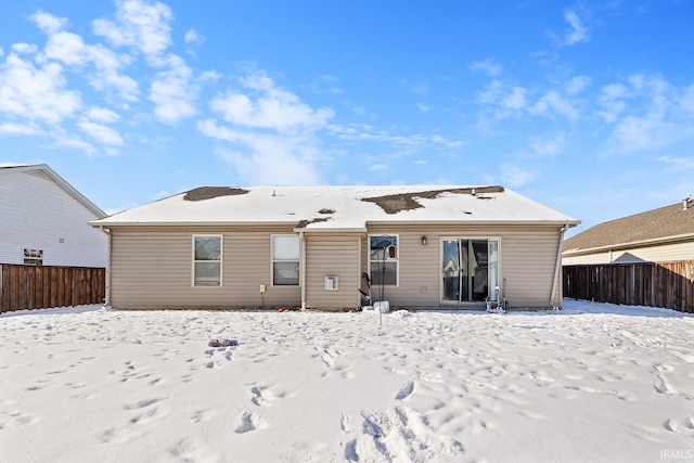 view of snow covered house