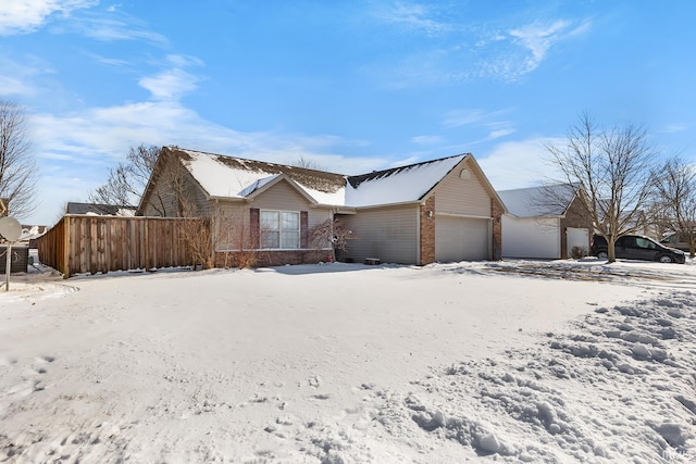 single story home featuring a garage