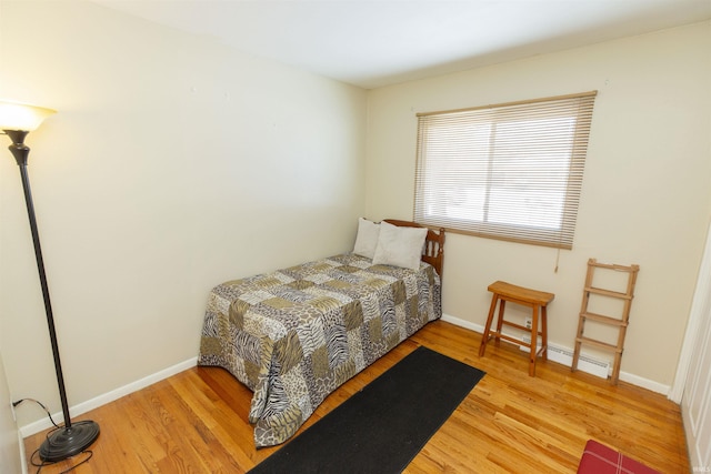 bedroom with light hardwood / wood-style floors