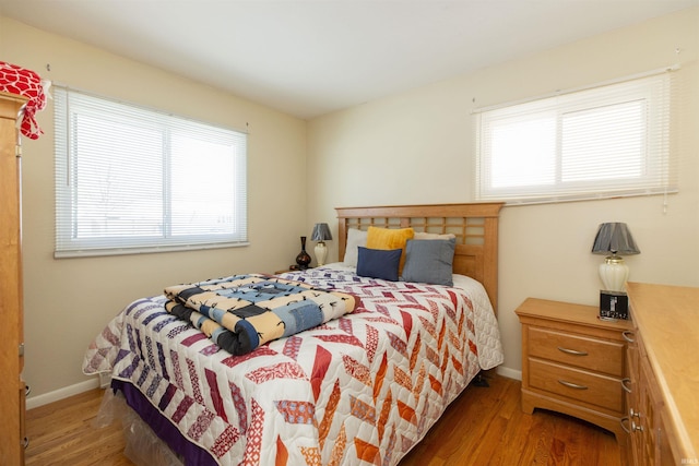 bedroom with hardwood / wood-style flooring