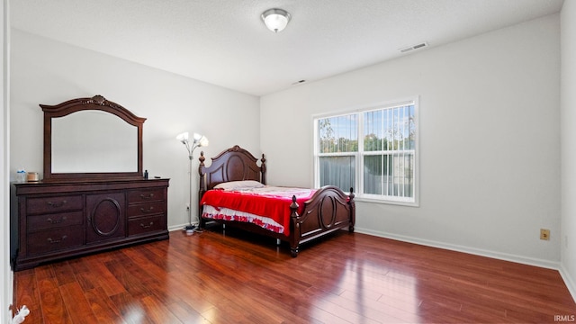 bedroom featuring dark hardwood / wood-style floors