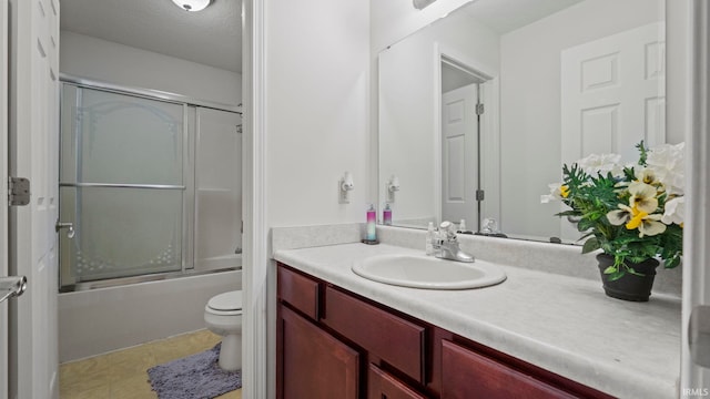 full bathroom with vanity, a textured ceiling, enclosed tub / shower combo, and toilet