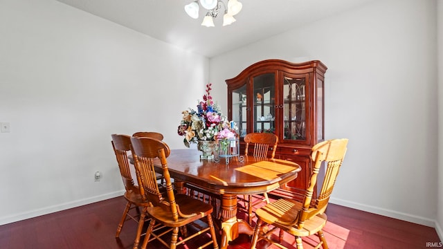 dining space with dark wood-type flooring