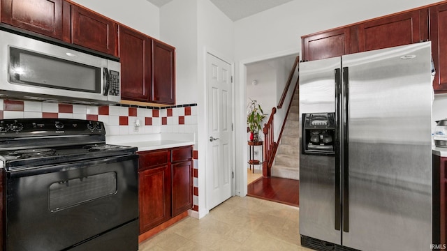 kitchen featuring stainless steel appliances and backsplash