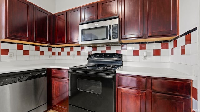 kitchen featuring decorative backsplash and appliances with stainless steel finishes