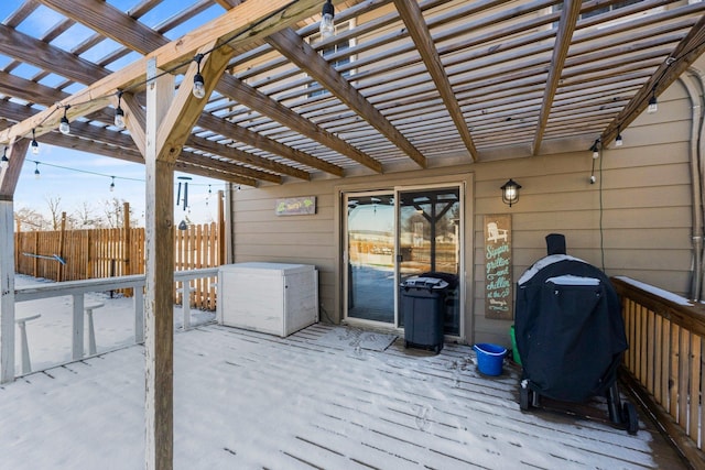 deck featuring a grill and a pergola