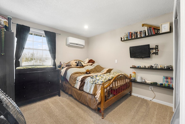 bedroom with light colored carpet, a textured ceiling, and an AC wall unit