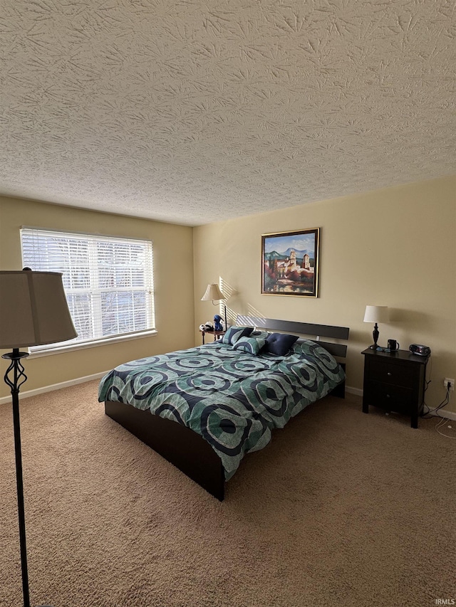 carpeted bedroom with a textured ceiling