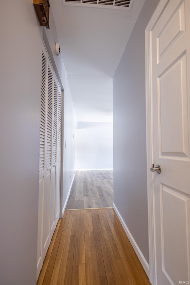 hall with light hardwood / wood-style flooring