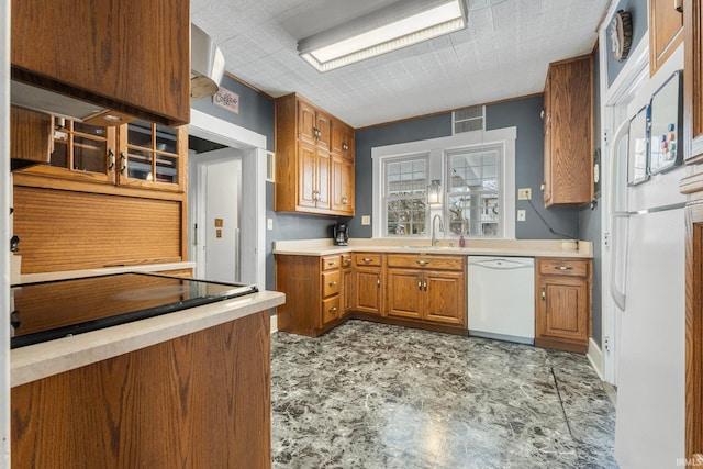 kitchen featuring sink and white appliances