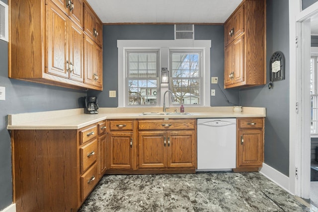 kitchen with white dishwasher and sink