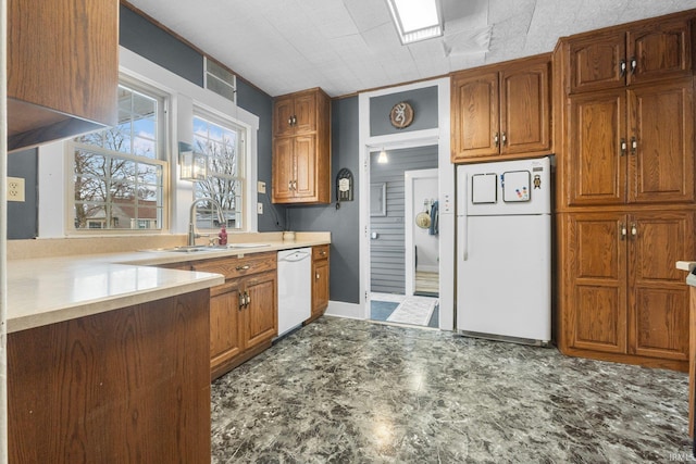 kitchen featuring sink and white appliances