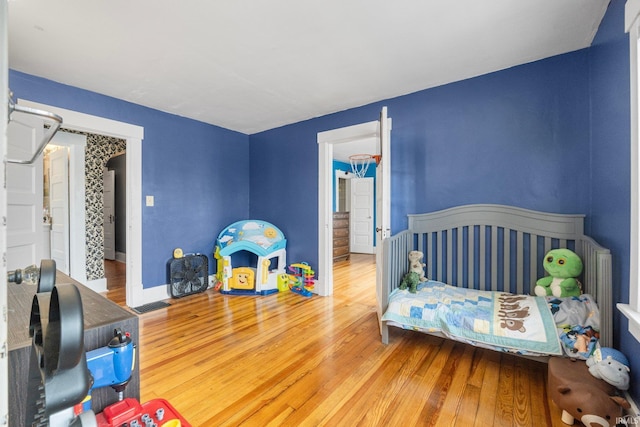 bedroom with hardwood / wood-style flooring