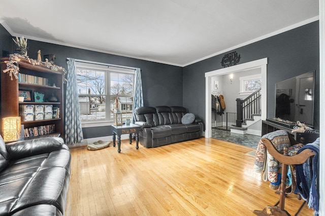 living room with ornamental molding and hardwood / wood-style floors