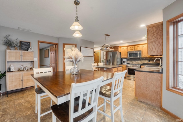 dining room featuring sink