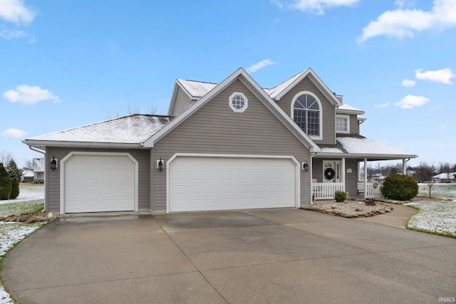 front of property with a garage and covered porch