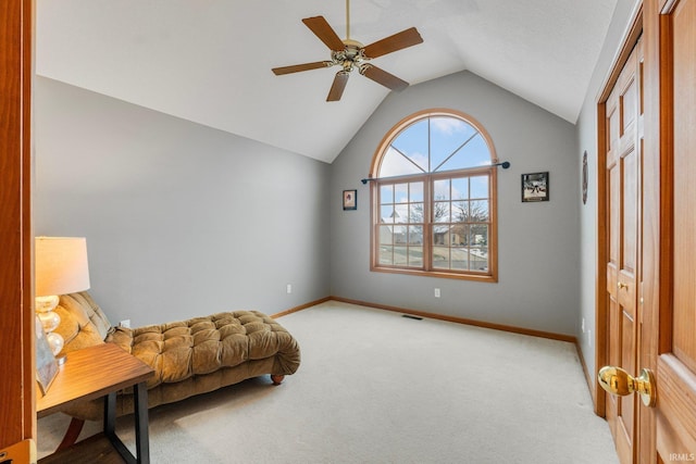 sitting room featuring lofted ceiling, light colored carpet, and ceiling fan