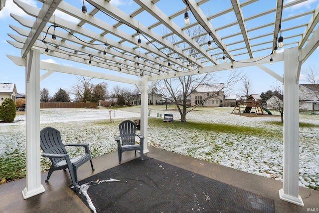 view of patio featuring a playground and a pergola