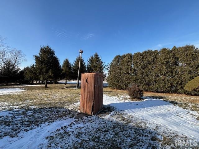 view of yard covered in snow