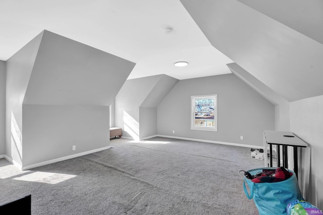 bonus room with lofted ceiling, carpet, and baseboards