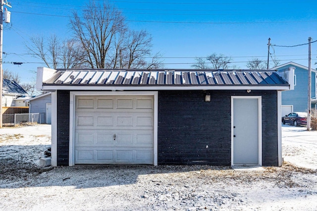 view of snow covered garage