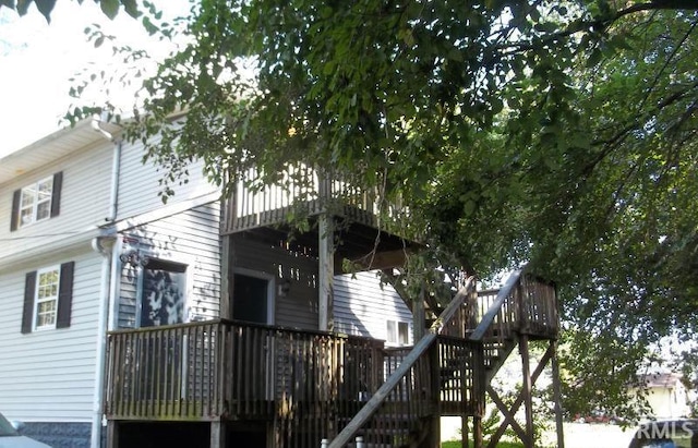 view of side of property with a deck